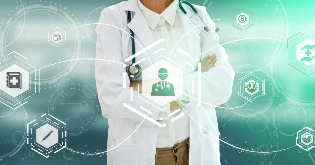  "Photo of a college student using a laptop while holding a brochure on health insurance options, demonstrating the process of researching coverage."