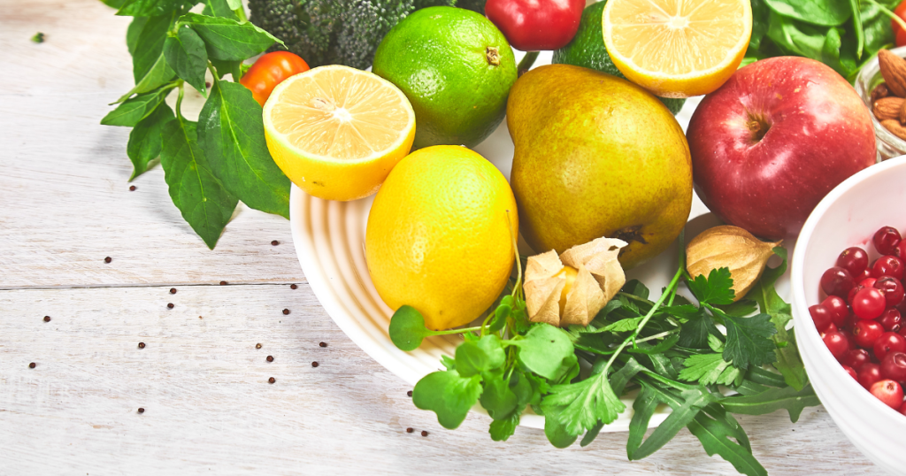 A collage of colorful fruits and vegetables with high antioxidant properties, such as berries, tomatoes