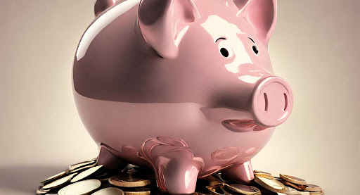 ("Piggy bank filled with coins, symbolizing saving money.")