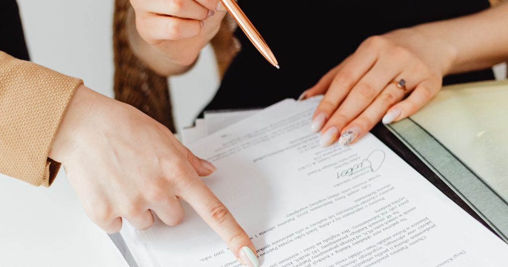 "Large stack of medical bills and paperwork representing the overwhelming administrative burden on healthcare providers."
